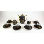 A Japanese black and gilt coffee set comprising:-coffee pot, milk, sugar and six cups and saucers