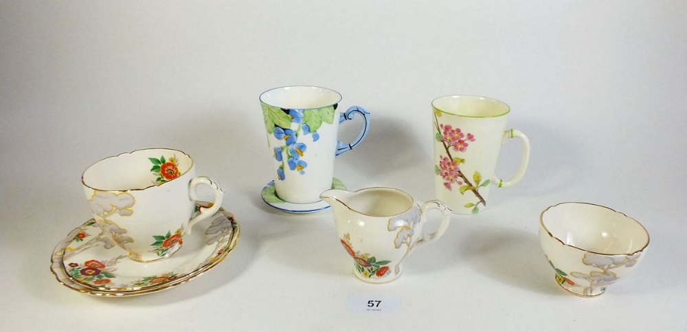 A Royal Cauldon floral trio with milk and sugar plus a Foley floral painted mug retailed by