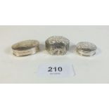 Three modern silver pill boxes with engraved decoration, total weight 40g.