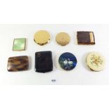 A selection of compacts and small cigarette cases