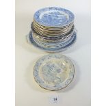 A selection of various 19th century English pottery blue and white willow pattern plates and dishes