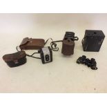 Various old cameras including Argus 75, Kodak Brownie, Halina, Kodak, pair of binoculars etc