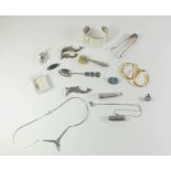 A selection of various silver jewellery including brooches, bangles etc. and some other white