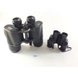 A pair of Carl Zeiss Jena Jenoptem 10 x 50 binoculars together with a pair of Bushnell 7 x 26