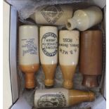 A selection of stoneware bottles including some beer and ginger ale bottles