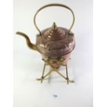 A late 19thC copper and brass Arts and Crafts spirit kettle and stand.