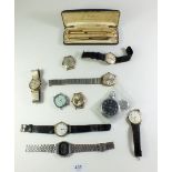 A box of vintage gentleman?s wrist watches including Cronel, Enicar and Corso plus a pen set, boxed