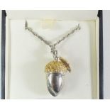 A silver and gilt acorn pendant