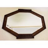 A 1920's oak framed mirror with beaded decoration, 86 x 64cm