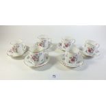 A set of six Royal Albert coffee cups and saucers decorated with roses as originally sold in Lawleys