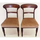 A pair of mahogany splat back scrolled chairs