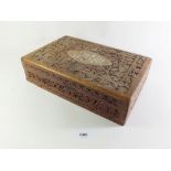 An Indian carved wooden jewellery box, 31cm wide