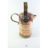 A 19th century copper and brass covered hot water jug, 22cm