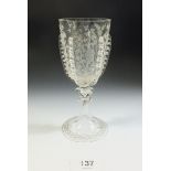 A 19th century Venetian wine glass with applied trailing decoration and engraved flowers, foliage