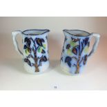 A pair of 19thC Staffordshire flow blue jugs with lemon decoration - 20cm