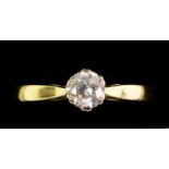 An 18 carat gold diamond solitaire ring, size N/M
