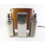 A leather cased huntsmans or picnic set with two thermos and sandwich box,