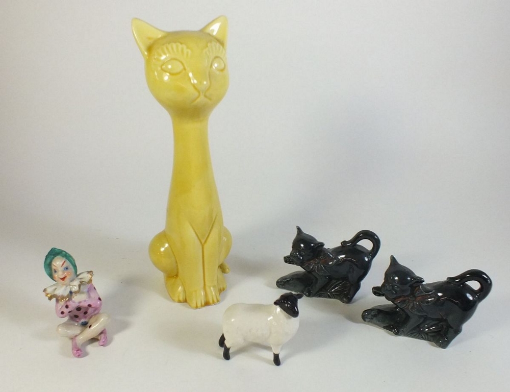 Two black cat spill vases, yellow cartoon cat, Beswick sheep and pixie figure