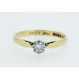 An 18 carat gold diamond solitaire ring with platinum setting, size 0/P, 2.8g