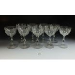A set of nine early 20th century sherry glasses with cut stems and panel cut bowls