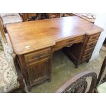 An early 20th century French satin walnut twin pedestal desk