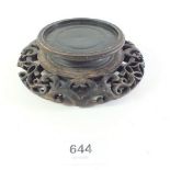 A late 19th century early 20th century Chinese carved wooden stand for a vase a/f, 14cm diameter