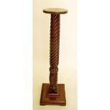 A Victorian mahogany spiral carved torchere stand 110cm tall