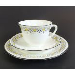 A 1920's Shelley Porcelain tea set in the Bell pattern (no. 11233), comprising 9 trios, 2 cake