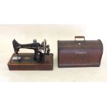 A Singer 99K sewing machine in original box with accessories