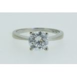 A cubic zirconia solitaire ring with 9 carat white and gold shank, size K ½