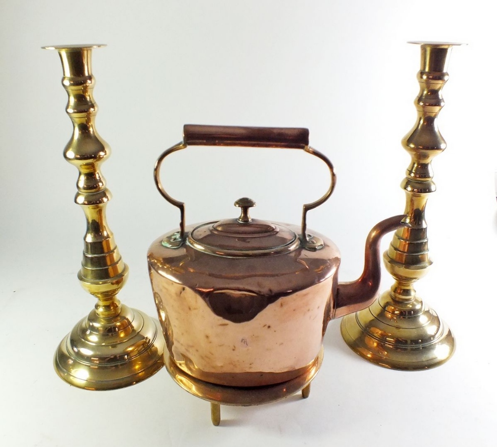 A copper kettle and a pair of candlesticks