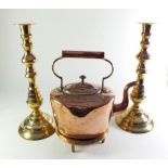 A copper kettle and a pair of candlesticks
