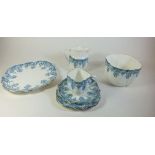 An Edwardian tea service with blue printed decoration comprising twelve cups and saucers (one cup