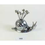 A set of snail picks in metal novelty snail form holder