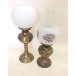 Two small brass 19th century oil lamps with shades, tallest 49cm.