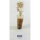 A Victorian bone and cork floral carved bottle stopper with stanhope (image missing)