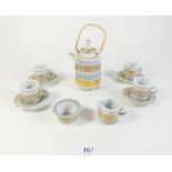 A Mary Rich miniature tea service comprising teapot, four cups and saucers, milk and sugar (one