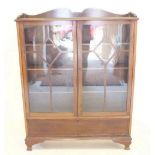 An early 20th century mahogany glazed two door display cabinet, 110cm wide