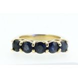 A 9 carat gold ring set five sapphires