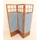 An early 20th century three fold mahogany screen with glazed upper section