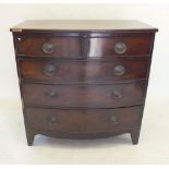 A Victorian mahogany bow fronted chest of drawers on spaly feet
