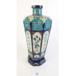 A 19th century Chinese Fahua vase with turquoise panelled decoration, 27cm tall