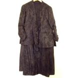 A Victorian black satin skirt and jacket