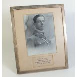 A silver photo frame with inset photo for Henry de Courcy Prince of Lorraine, frame measures 25cm by