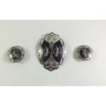 A Siam silver brooch and earrings