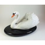 A large Franklin Mint model swan on wooden base