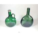 Two Victorian green glass moulded bottles, one with silver collar
