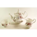 A Royal Albert Lavender Rose tea service comprising teapot, milk, sugar, cake plate, six cups