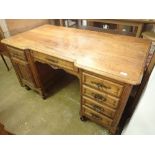 An early 20th century French satin walnut twin pedestal desk