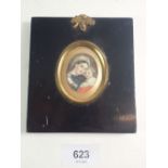 A 19th century oval watercolour on ivory miniature of classical mother and child, within ebonised